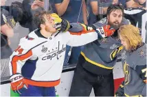  ?? ROSS D. FRANKLIN/ASSOCIATED PRESS ?? Washington’s John Carlson, left, and Vegas’ Alex Tuch tussle during the second period of Game 5 on Thursday night. The Capitals overcame a 3-2 third-period deficit to win the Stanley Cup.