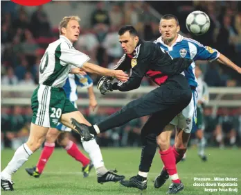  ??  ?? Pressure...Milan Osterc closes down Yugoslavia keeper Ivica Kralj