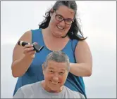  ?? 15_T30_Tiree Show_30/32 ?? Marion Burns braves a shave by Emma Rogers for Macmillan Cancer Support. Afterwards Marion said: ‘I do not want to look in the mirror.’