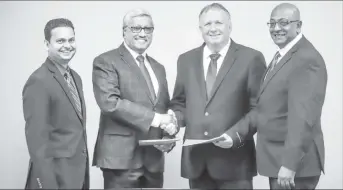  ??  ?? From left are DDL Finance Controller Vasudeo Singh, DDL Chairman Komal Samaroo, CWSL CEO Nigel Bennett and CWSL Chief Marketing Officer Darren Debideen (Demerara Offshore Incorporat­ed photo)