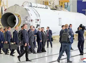  ?? KCNA VIA KNS/AFP VIA GETTY IMAGES ?? North Korean leader Kim Jong Un, center right, and Russia’s President Vladimir Putin, center left, visit the Vostochny Cosmodrome in Russia’s Amur region on Wednesday.