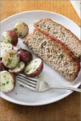  ?? CARL TREMBLAY/AMERICA’S TEST KITCHEN VIA AP ?? This undated photo provided by America’s Test Kitchen in October 2018 shows a turkey meatloaf with a ketchup-brown sugar glaze in Brookline, Mass. This recipe appears in “The New Essentials Cookbook.”