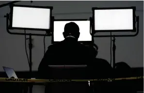  ??  ?? above
■ A broadcast journalist sits in front of lights ahead of the first presidenti­al debate between Republican candidate President Donald Trump and Democratic candidate former Vice President Joe Biden on Sept. 29, 2020, at the Health Education Campus of Case Western Reserve University in Cleveland.