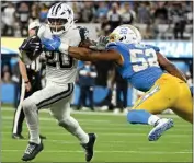  ?? WILL LESTER – STAFF PHOTOGRAPH­ER ?? Chargers edge rusher Khalil Mack chases down Cowboys running back Tony Pollard during Sunday's game.