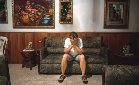  ?? ADRIANA LOUREIRO FERNANDEZ The New York Times ?? Rosmery Bislick — whose brother, José Carmelo Bislick, was killed in August — mourns at the family’s home in Guiria, Veneuela, on Oct. 10. Those responsibl­e for his death remain at large.