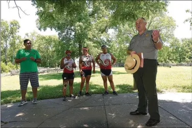  ?? NWA Democrat-Gazette/FLIP PUTTHOFF ?? Kevin Eads, superinten­dent of Pea Ridge National Military Park, shares the history of Cherokee Indians within the park site and at the Battle of Pea Ridge with bicyclists on the Remember the Removal tour. Eleven contingent­s of the Trail of Tears traveled through the park area in 1839, and journals record nights spent in Ruddick’s and Lewis Pratt’s fields 1839. Two Cherokee rifle units fought for the Confederac­y during the battle in 1862.