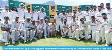  ?? — AFP ?? CAPE TOWN: South Africa (L) and India (R) players pose with the trophy after drawing the series at Newlands stadium in Cape Town on January 4, 2024.