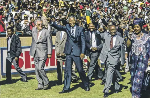  ?? Photo: Louise Gubb/corbis Saba/getty Images ?? Foundation­al steps: Joe Slovo, Nelson Mandela, Jacob Zuma, Alfred Nzo and Winnie Madikizela-mandela during a rally for Mandela. Slovo said in 1990 that the party’s leaders must ‘turn the snowfall of talks into an avalanche of transforma­tion’.