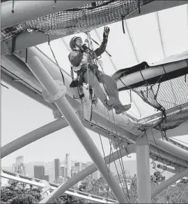  ?? Allen J. Schaben Los Angeles Times ?? BUILDERS in California added 11,100 jobs in January. Above, a worker helps build the L.A. Football Club’s new soccer stadium at Exposition Park last month.