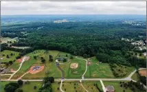  ??  ?? An aerial view of the proposed 160-acre rezoning area (center wooded area) and Indian Shoals Road in Decula. An applicatio­n was submitted to rezone the area to allow for a new subdivisio­n.