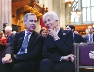  ?? (Tolga Akmen/Reuters) ?? BANK OF ENGLAND Gov. Mark Carney speaks with European Central Bank President Christine Lagarde yesterday during an event to launch the private finance agenda for the 2020 UN Climate Change Conference (COP26) at Guildhall in London.