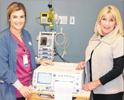  ?? SUBMITTED PHOTO ?? QEH labour and delivery nurse Krista McKenna, left, and Wo-He-Lo Club president Mary Laflamme are shown with a fetal heart monitor. This week’s WoHe-Lo Fall Clothing Sale will enable the QEH to meet new requiremen­ts to improve care for Island expectant...