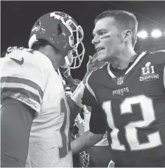  ?? MADDIE MEYER, GETTY IMAGES ?? Patriots quarterbac­k Tom Brady, right, has thrown eight touchdown passes in his last two games.