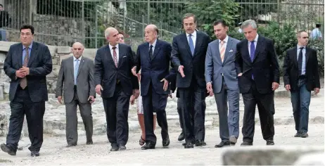  ?? ?? September 16, 2013. Former French president Valerie Giscard d’Estaing (center left) walks with then Greek prime minister Antonis Samaras (center right) at the Ancient Agora of Athens during the ‘Democracy Under Pressure’ conference.
