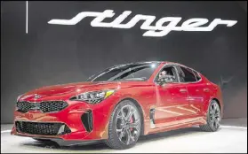  ?? SCOTT OLSON / GETTY IMAGES ?? Kia Motors introduces the 2018 Stinger at the North American Internatio­nal Auto Show on Monday in Detroit. The show is open to the public Jan. 14-22.