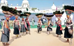  ??  ?? Folk artistes performing the Ghusadi dance form of Telangana
