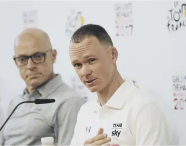  ??  ?? 0 Chris Froome, right, and Sky team manager Sir Dave Brailsford meet the media in Dusseldorf.