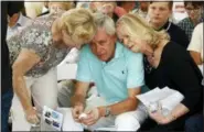  ?? PATRICK SEMANSKY — ASSOCIATED PRESS ?? Carl Hiaasen, center, brother of Rob Hiaasen, one of the journalist­s killed in the shooting at the Capital Gazette newspaper in Annapolis, Md., is consoled by his sisters Barb, left, and Judy during a memorial service Monday in Owings Mills, Md.