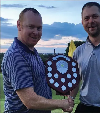  ??  ?? The MacBride Pitch & Putt Summer League winner Barry Thornton receives the League shield from club secretary