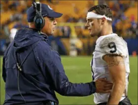  ?? GENE J. PUSKAR — THE ASSOCIATED PRESS ?? Penn State coach James Franklin, left, talks with quarterbac­k Trace McSorley during a college football game against Pittsburgh last weekend. Penn State practiced at a rapid clip this week to prepare for fast-paced Kent State, the fastest offense the Nittany Lions could face all season.