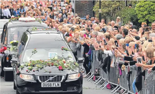  ??  ?? Sir Cliff Richard said: “Being driven here was a fantastic experience, you forget how much people loved her,” while many paid their respects as the cortege passed by.