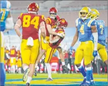  ?? Ashley Landis The Associated Press ?? Southern Cal receiver Drake London (15) embraces teammate Amon-ra St. Brown after his touchdown Saturday against UCLA.