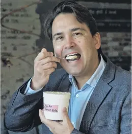  ?? PHOTO: GERARD O’BRIEN ?? Chilled out . . . Newly minted National Party foreign affairs spokesman Simon Bridges tucks into a sample during a visit to Patti’s and Cream in Mornington, Dunedin yesterday.