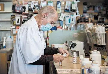  ?? ERIN HOOLEY/CHICAGO TRIBUNE ?? Pharmacist Eddie Levin, 82, works at Kedvon Pharmacy in Wheeling, where he was hired after appealing for a new job.