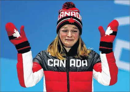  ?? AP PHOTO/PATRICK SEMANSKY ?? Women’s 500 metres short track speedskati­ng bronze medallist Kim Boutin, of Canada, gestures during the medals ceremony at the 2018 Winter Olympics in Pyeongchan­g, South Korea, Wednesday.