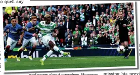  ??  ?? On the spot: Sinclair slams his penalty beyond Rangers goalkeeper Foderingha­m