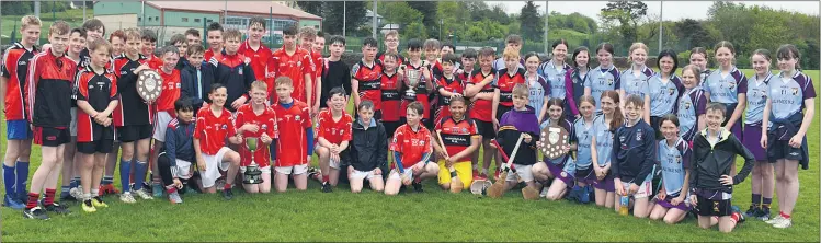  ?? ?? Winning schools at the St. Colman’s College Blitz display their hard earned silverwear.