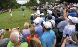  ?? JEFF SINER — THE CHARLOTTE OBSERVER VIA AP ?? Dustin Johnson follows through on his drive during practice for the PGA Championsh­ip at Quail Hollow Club in Charlotte, N.C., Monday.