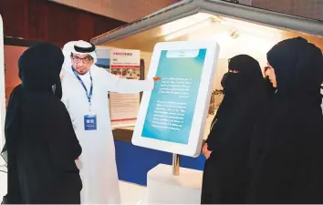  ?? Courtesy: DHA ?? A DHA official explains the workings of the Disaster and Crisis Management Office at the DIHAD conference in Dubai. Its operations and control Centre will be equipped with advanced systems.