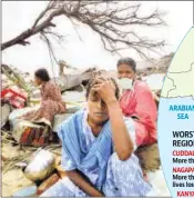  ??  ?? Women grieve amid the debris of their damaged houses in Nagappatti­nam, Tamil Nadu, on January 1, 2005. AP FILE