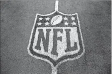  ?? LM OTERO/AP PHOTO ?? In this Oct. 13, 2013, file photo, an NFL logo in shown on the field after a game between Washington and Dallas in Arlington, Texas.