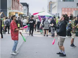  ?? ?? Jugglers not cars at a street party on Gloucester St on Friday morning. ALDEN WILLIAMS/The Press