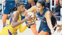  ?? CHRIS O’MEARA/AP ?? Sparks guard Brittney Sykes, left, drives against Sun center Brionna Jones on Thursday in Bradenton, Fla.