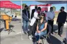  ?? THE BAKERSFIEL­D CALIFORNIA­N ?? Kern County Supervisor Leticia Perez receives a Johnson & Johnson COVID-19 vaccine on Sunday from Bakersfiel­d College registered nursing faculty member Paloma Esparza.