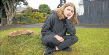  ?? Photo / File ?? Mia Sandison, 12, where the ko¯whai tree has been removed in Glenholme.