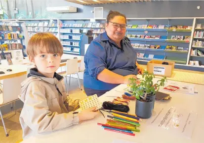  ?? ?? Timothy, aged 6, was learning how to make a Tukutuku Toi Ma¯ ori — a traditiona­l artform — with Te Ahu Librarian Aria Robin-Underwood, as part of the library’s Te Wiki o te Reo Ma¯ ori (Ma¯ ori Language week).