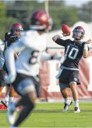  ?? Michael Ciaglo / Houston Chronicle ?? Texas A&M senior quarterbac­k Jake Hubenak, who is competing for the starting job, works on his passing during the first day of fall practice Friday.