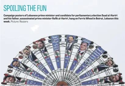  ?? Picture: Reuters ?? Campaign posters of Lebanese prime minister and candidate for parliament­ary election Saad al-Hariri and his father, assassinat­ed prime minister Rafik al-Hariri, hang on Ferris Wheel in Beirut, Lebanon this week.