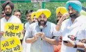  ?? ANIL DAYAL/HT ?? AAP MP Bhagwant Mann (C) and leader of opposition Sukhpal Singh Khaira at a protest in Chandigarh on Monday.