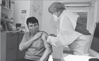  ?? XINHUA VIA MTI ?? Hungarian President Janos Ader is given a vaccine from Sinopharm on Friday.