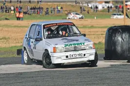  ??  ?? Angus and and Michael McNeil from Oban in their Ford Escort Mk2.