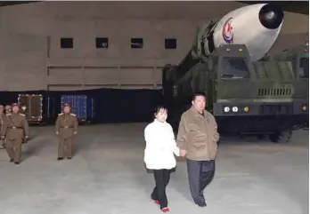  ?? — AFP ?? North Korean leader Kim Jong Un, along with his daughter, inspects an interconti­nental ballistic missile (ICBM).