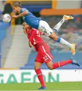  ?? AFP ?? Dominic Calvert-Lewin (right) of Everton in action against Liverpool during their English Premier League match at Goodison Park in Liverpool on Saturday. The match ended in a 2-2 draw. —