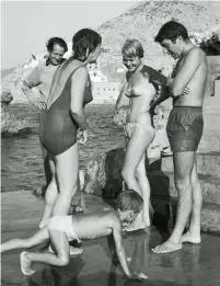  ??  ?? Far left Ihlen and Cohen (right) watch their friends’ son on the beach in Hydra, October 1960.