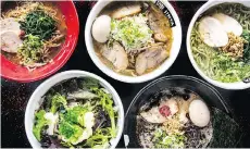  ??  ?? Jinya Ramen Bar has a variety of ramen bowls on its menu, including dishes with pork, chicken and fish.