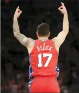  ?? SETH WENIG — THE ASSOCIATED PRESS ?? Philadelph­ia 76ers’ JJ Redick reacts after hitting a threepoint basket during the second half of the NBA basketball game against the New York Knicks, Monday in New York. The 76ers defeated the Knicks 10598.